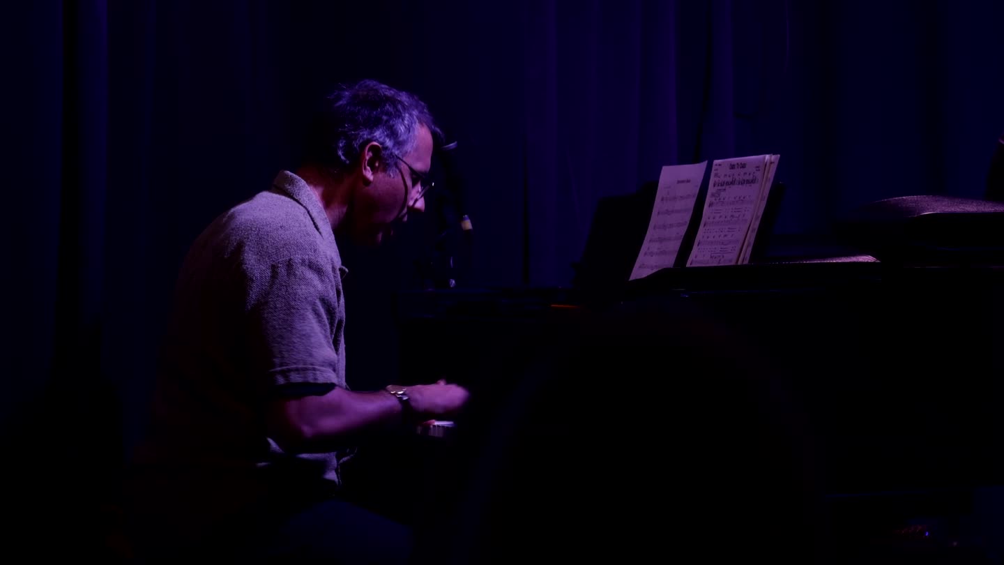 Pianist playing the grand piano during the Mohawk faculty performance at Tabone