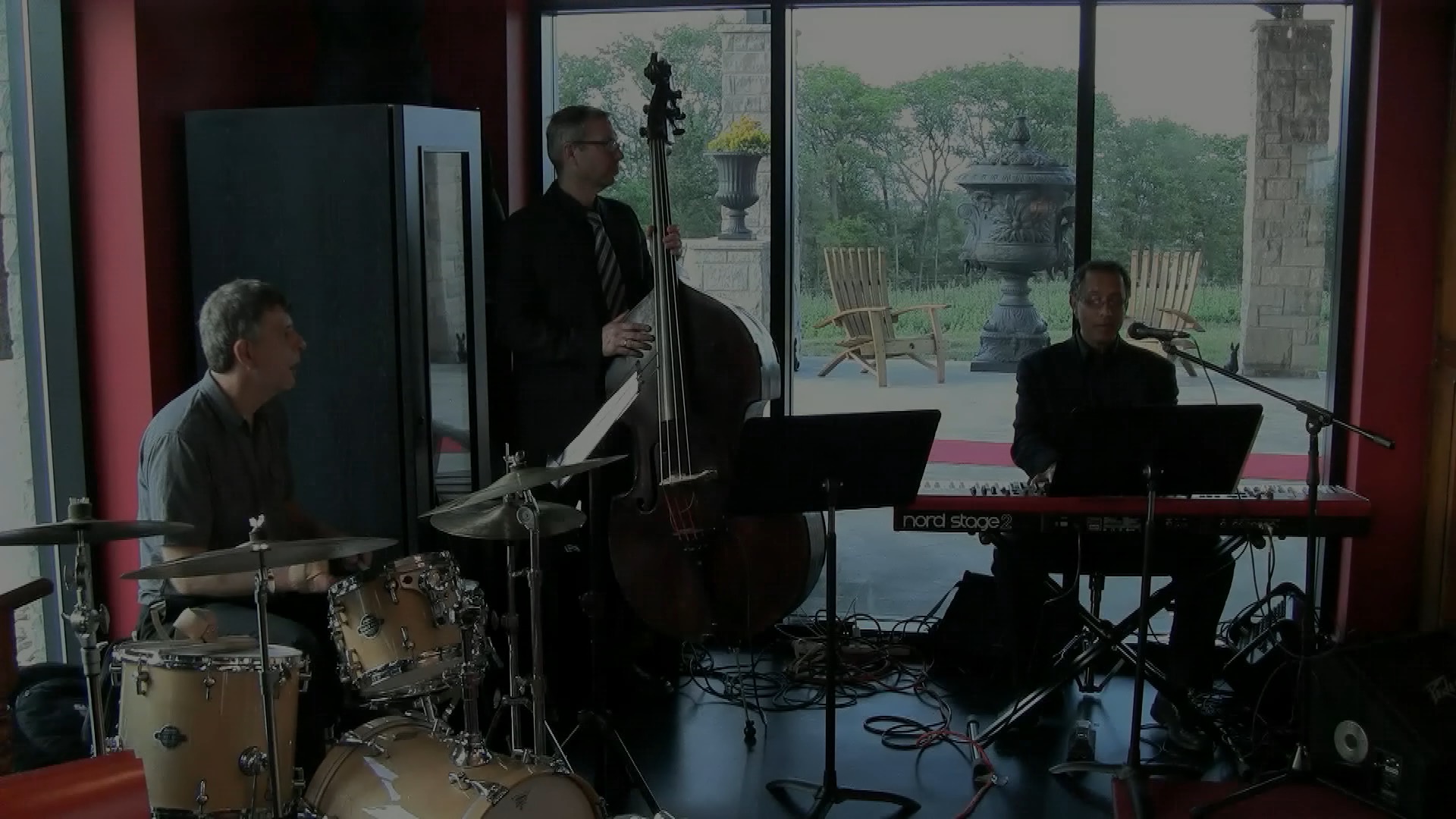 Jazz trio with keyboard, double bass, and drums